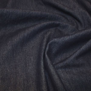 Close-up of dark blue denim fabric texture.