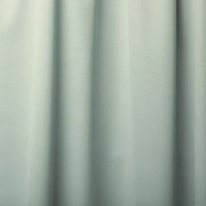 Close-up of grey fabric curtain with folds.