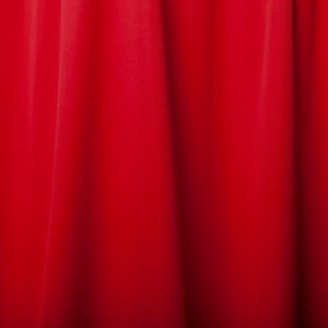Bright red curtain fabric close-up