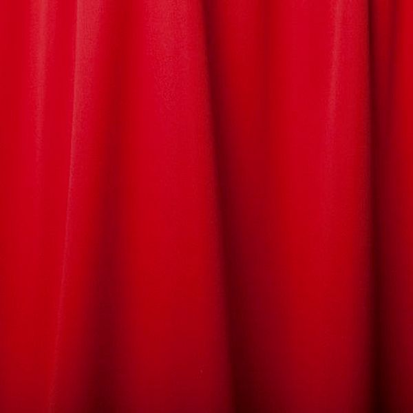 Bright red curtain fabric close-up