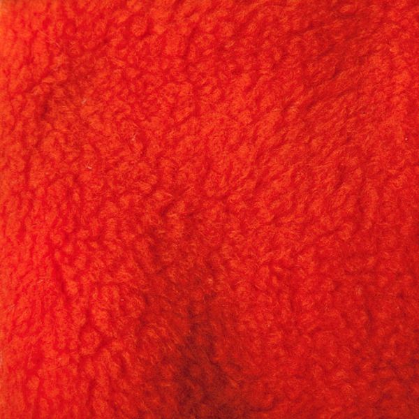 Close-up of red textured fabric surface.