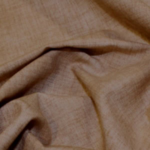 Close-up of crumpled beige fabric texture