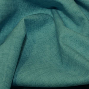 Close-up of teal fabric texture and folds.