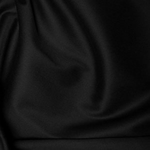 Close-up of black satin fabric texture