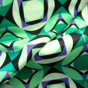 Abstract geometric green and purple fabric pattern