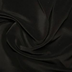 Dark, smooth, flowing fabric texture close-up