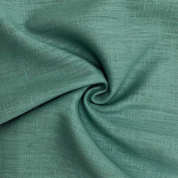 Green fabric with swirling texture pattern.