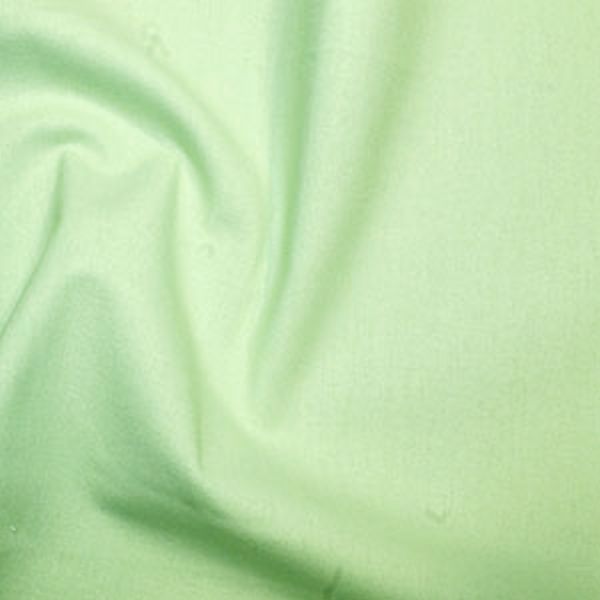 Close-up of light green fabric texture.
