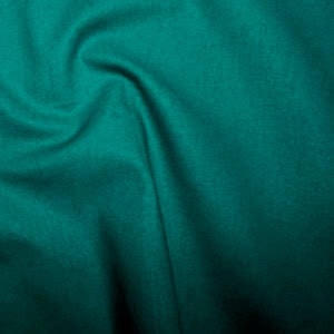 Turquoise fabric with soft folds and texture.