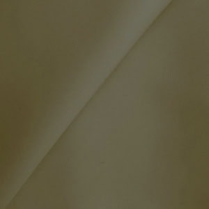 Close-up of folded beige fabric texture