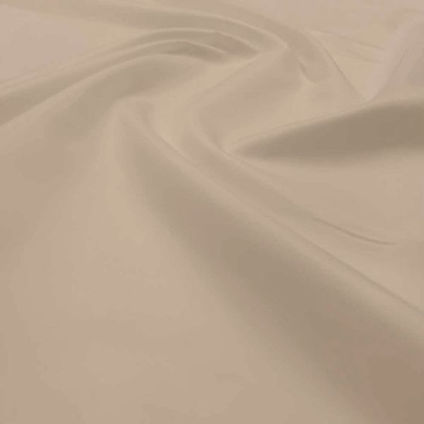 Smooth ivory textile fabric close-up.