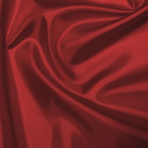Smooth red fabric with elegant folds.