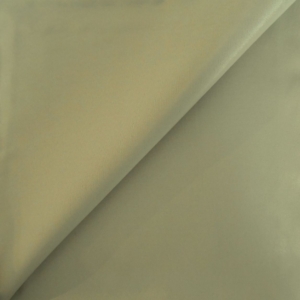 Folded beige fabric material close-up