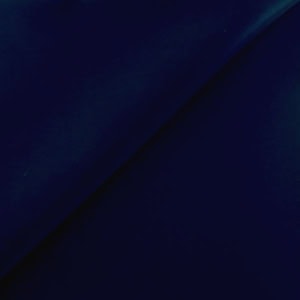 Dark blue fabric with subtle folds.