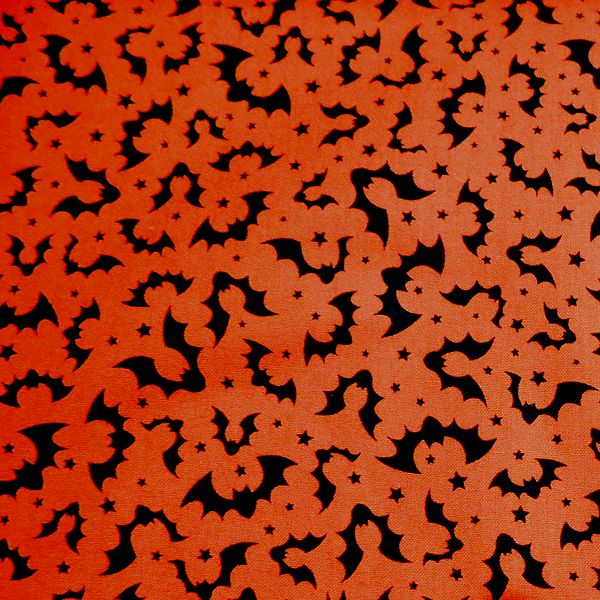 Halloween-themed fabric with bats and stars pattern.