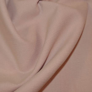 Close-up of folded pink fabric texture.