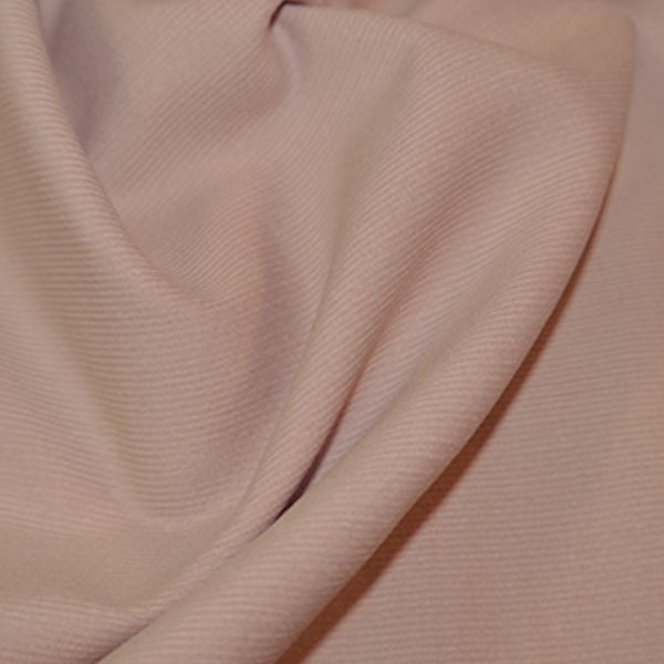 Close-up of folded pink fabric texture.