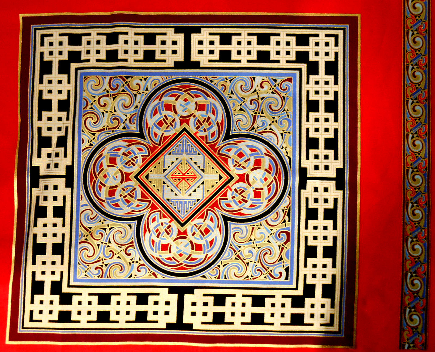 Ornate geometric pattern with red, blue, gold accents.