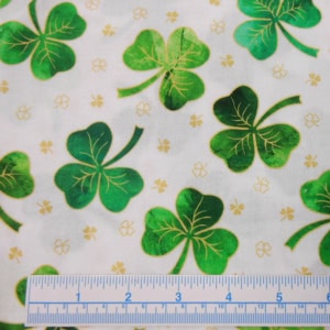 Green clover pattern fabric with measurement scale