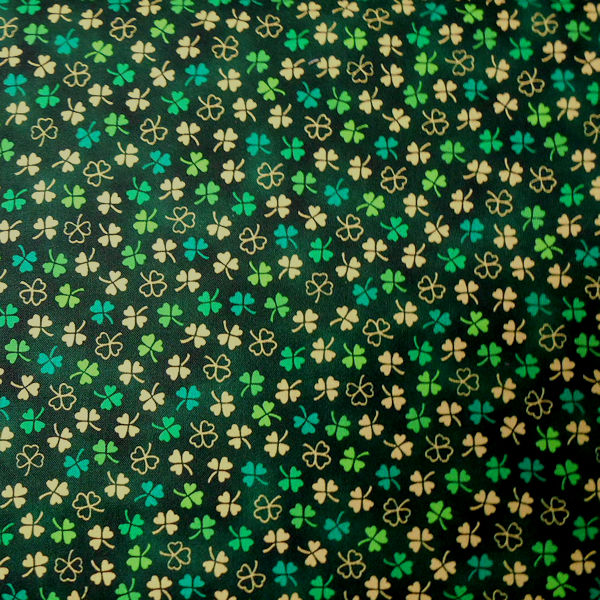 Green and cream shamrock patterned fabric background