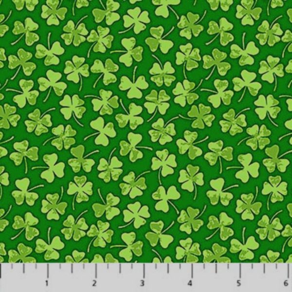 Green fabric with clover leaf pattern and ruler