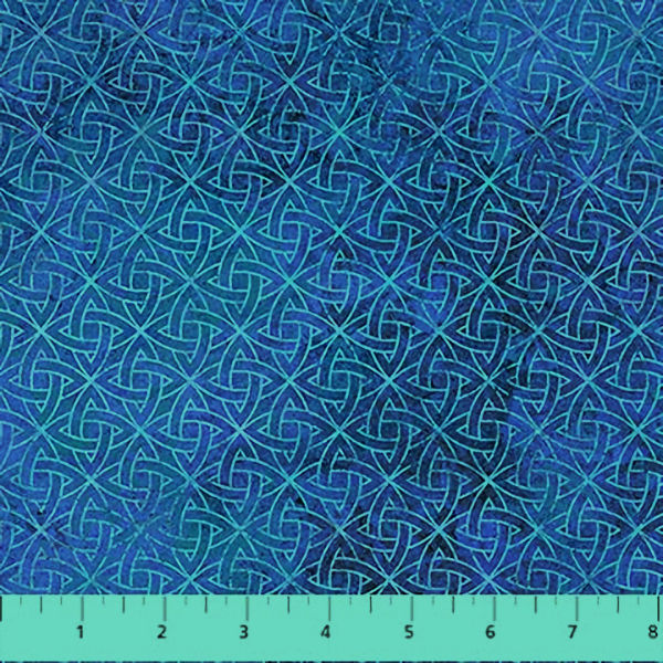 Blue Celtic knot fabric pattern with ruler.