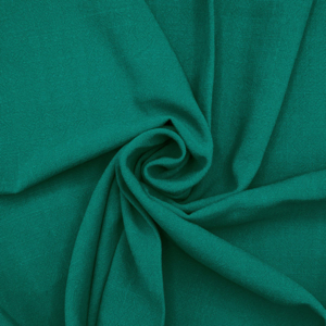 Green creased fabric swirled in centre.