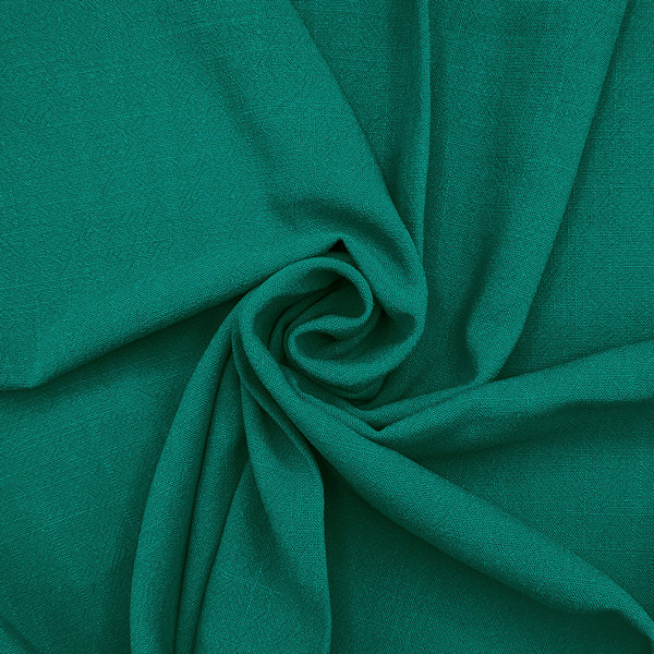 Green creased fabric swirled in centre.