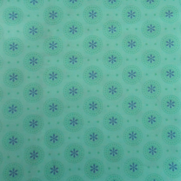 Teal fabric with circular floral pattern