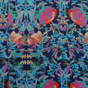 Colourful floral patterned fabric on dark background.