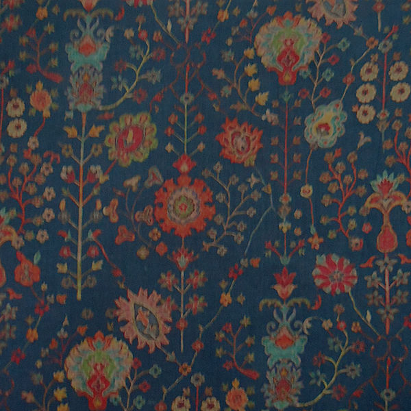 Ornate floral pattern on blue background.